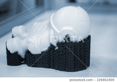 Object model printed on a 3D printer from molten plastic. 3D printer printed prototype of toy from molten plastic. 3D design and prototyping. Additive progressive new modern 3d printing technology 109802809