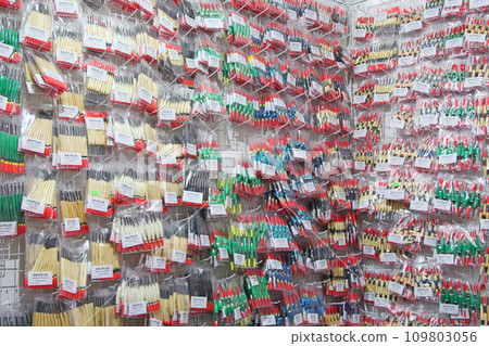 Colorful fishing floats on sale in supermarket. Fishing bobs are sold in store Colorful fishing floats on sale in supermarket. Fishing bobs are sold in store 109803056