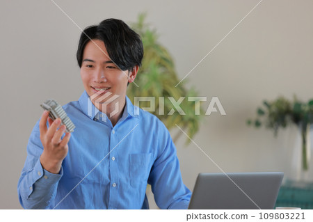 Engineer 2 smiling while holding an aluminum workpiece Engineer 2 smiling while holding an aluminum workpiece 109803221