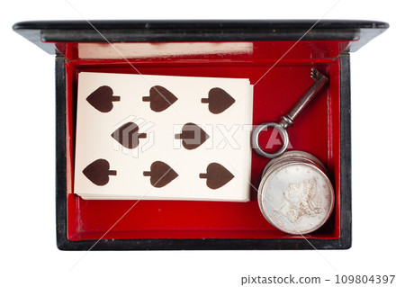 vintage old black and red casket with vintage playing cards and silver dollar coins vintage old black and red casket with vintage playing cards and silver dollar coins 109804397