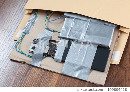 Mail bomb IED - Improvised Explosive Device with c4 and cell phone module in envelope 109804418
