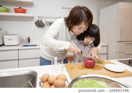Mother and daughter kitchen help cooking 109805396