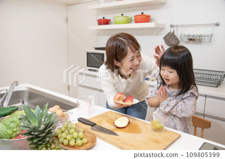 Mother and daughter kitchen help cooking 109805399