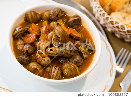 Snails stewed to homemade with chorizo 109808257