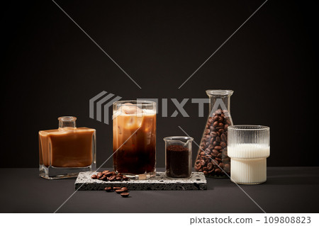 The ingredients for making milk coffee are displayed on a black background. Long-term drinking of caffeinated coffee has been associated with a reduced risk of prediabetes and diabetes. The ingredients for making milk coffee are displayed on a black background. Long-term drinking of caffeinated coffee has been associated with a reduced risk of prediabetes and diabetes. 109808823