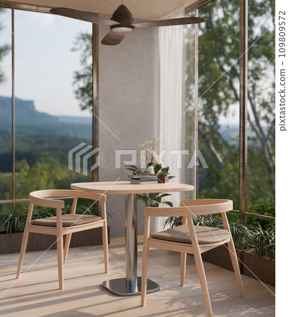 A modern Scandinavian room with a wooden dining table near by the glass window with a nature view. 109809572