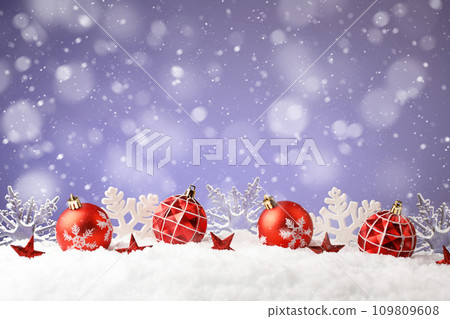 Christmas balls and snowflake with snow on color background 109809608