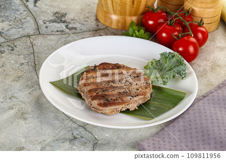 Grilled tuna medallion in the plate Grilled tuna medallion in the plate 109811956