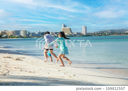 Children playing on the beach 109812507
