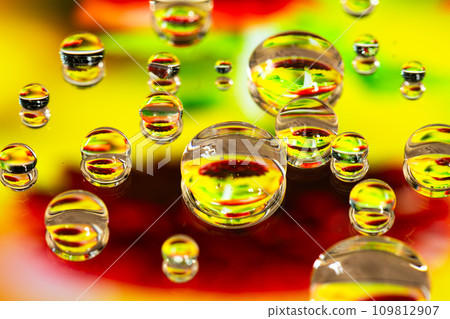 Flowers reflected in water drops Flowers reflected in water drops 109812907