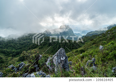 View of an evening dramatic cloud formation over the top of Doi Luang Chiang Dao in Chiang Mai, Thailand View of an evening dramatic cloud formation over the top of Doi Luang Chiang Dao in Chiang Mai, Thailand 109816405