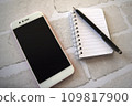 Smartphone and notepad 109817900