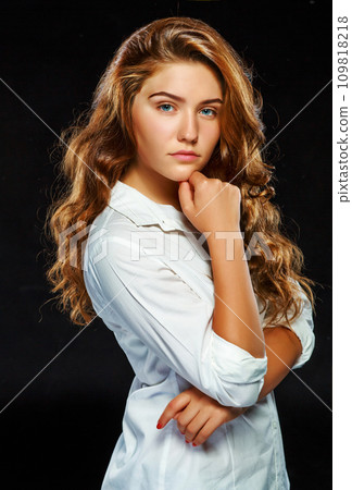 Portrait beautiful young brunette woman with wavy hair in white 109818218