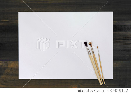 Artist Paint Brush on Blank White Paper. Top View. Drawing Tools in Art Studio. Artist Paint Brush on Blank White Paper. Top View. Drawing Tools in Art Studio. 109819122