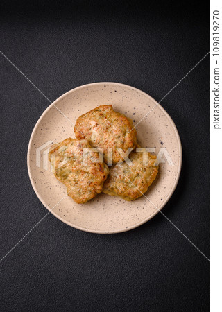 Delicious fresh fried minced fish cutlets with spices and herbs Delicious fresh fried minced fish cutlets with spices and herbs 109819270