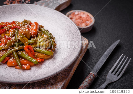 Mix of vegetables corn, carrots, peppers, broccoli, onions in teriyaki sauce 109819333
