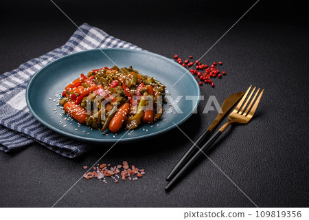 Mix of vegetables corn, carrots, peppers, broccoli, onions in teriyaki sauce 109819356