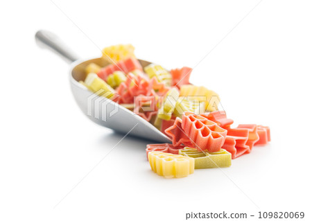 Uncooked raw pasta. Various Christmas shapes. Pasta in scoop isolated on white background. 109820069