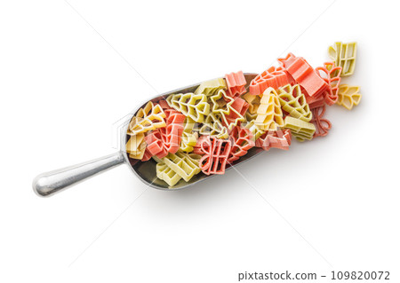 Uncooked raw pasta. Various Christmas shapes. Pasta in scoop isolated on white background. 109820072