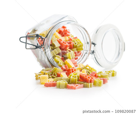 Uncooked raw pasta. Various Christmas shapes. Pasta in jar  isolated on white background. 109820087