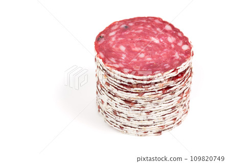Slices of salami sausage on a white background 109820749