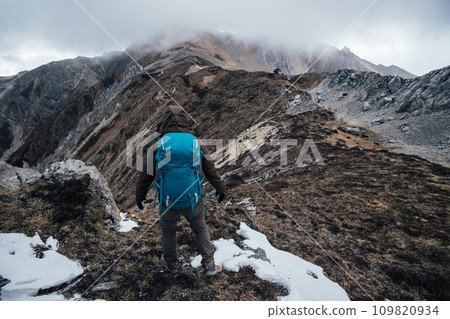 Woman hiker hiking at mountain top in tibet 109820934