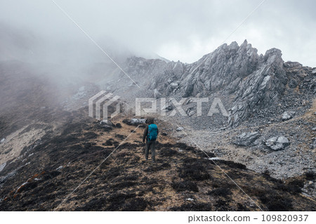 Woman hiker hiking at mountain top in tibet 109820937