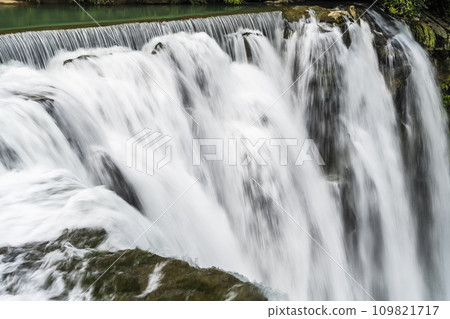 Close-up of the Waterfall at Shifen Scenic Area in New Taipei City, Taiwan. Close-up of the Waterfall at Shifen Scenic Area in New Taipei City, Taiwan. 109821717