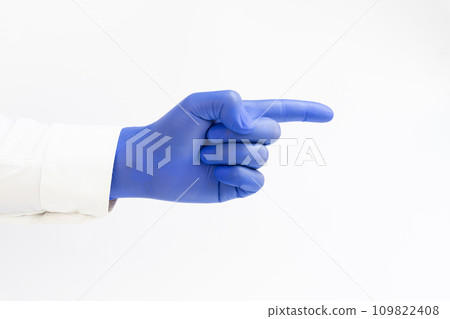 Doctor wearing blue latex Glove and pointing index finger. White background. Copy space 109822408