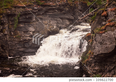Vintage-style cascades of Orkla River, flanked by granite cliffs in Stoa, Innlandet, Norway Vintage-style cascades of Orkla River, flanked by granite cliffs in Stoa, Innlandet, Norway 109822700