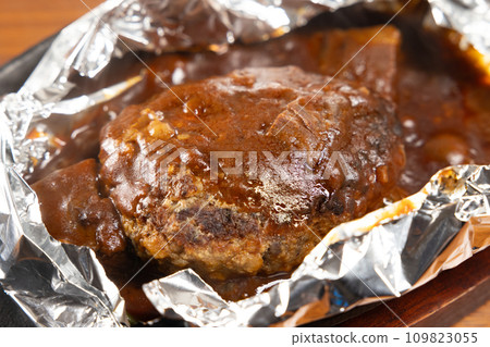 Delicious hamburger wrapped in aluminum foil 109823055