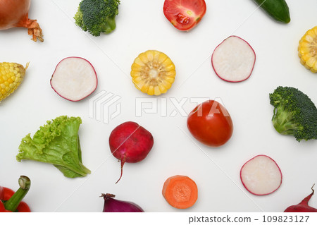 Creative layout, flat lay sliced various vegetables on white background. Healthy food concept. 109823127