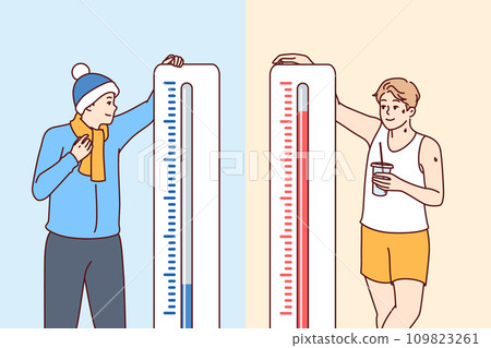 Man stands near thermometers showing different temperatures and feels heat or cold 109823261