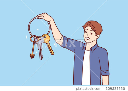Man holds bunch keys from house and smiles, feeling safety thanks presence reliable locks 109823330