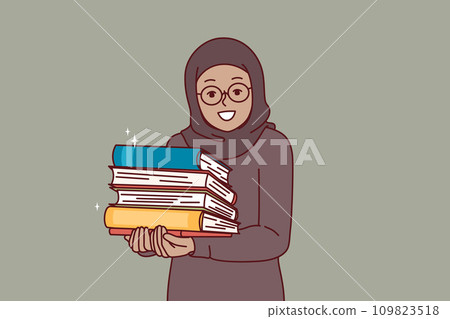 Arab little girl in hijab holds religious books with prayers in hands and looks at screen with smile Arab little girl in hijab holds religious books with prayers in hands and looks at screen with smile 109823518