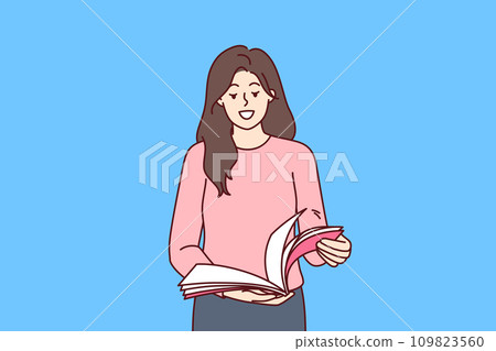 Woman stands with magazine in hands and flips through pages publication to learn about style trends 109823560