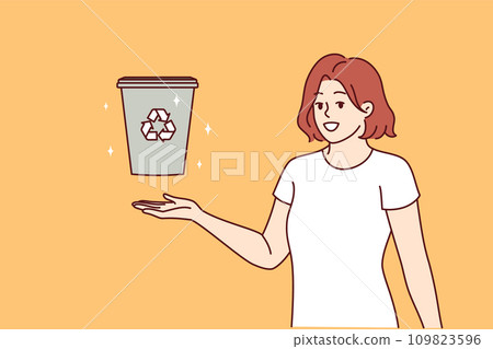 Woman displays trash can with recycling sign and calls for sorting garbage to take care environment Woman displays trash can with recycling sign and calls for sorting garbage to take care environment 109823596