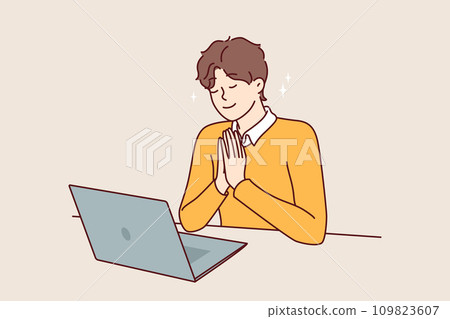 Man prays sitting in front laptop and watching broadcast religious event from catholic church 109823607