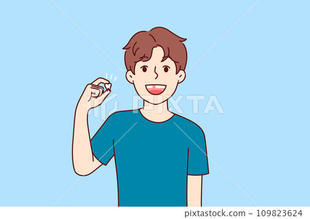 Happy kid demonstrates lost baby tooth and smiles, rejoicing at beginning of growing up Happy kid demonstrates lost baby tooth and smiles, rejoicing at beginning of growing up 109823624