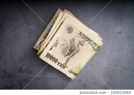 banknotes on dark background 109823888