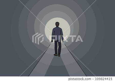 Man walks through tunnel towards exit, striving to achieve success and get out problematic situation 109824415