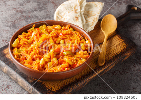 Chakalaka is a vegetarian South African dish which can fit into many categories it can be a salsa, a relish, a condiment, or a main dish closeup on the bowl. Horizontal 109824603