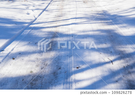 A frozen and slippery snowy road A frozen and slippery snowy road 109826278