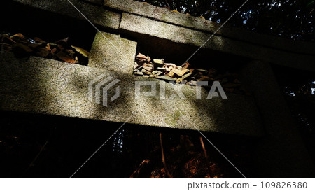 Pebbles piled up at the torii gate 109826380