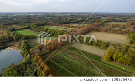 Aerial View of Countryside Landscape with Fields and Water Body 109826476