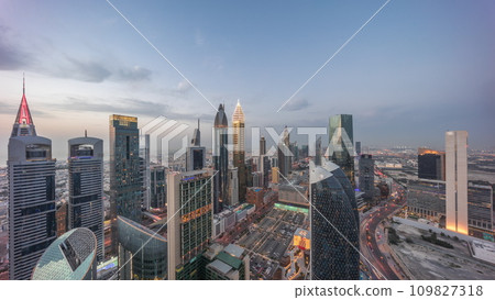 Skyline view of the high-rise buildings on Sheikh Zayed Road in Dubai aerial day to night timelapse, UAE. Skyline view of the high-rise buildings on Sheikh Zayed Road in Dubai aerial day to night timelapse, UAE. 109827318
