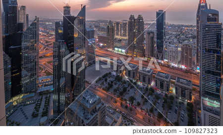 High-rise buildings on Sheikh Zayed Road in Dubai aerial day to night timelapse, UAE. High-rise buildings on Sheikh Zayed Road in Dubai aerial day to night timelapse, UAE. 109827323