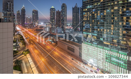 Business bay district skyline with modern architecture day to night timelapse from above. Business bay district skyline with modern architecture day to night timelapse from above. 109827344