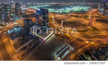 Huge highway crossroad junction between JLT district and media city aerial day to night timelapse. Huge highway crossroad junction between JLT district and media city aerial day to night timelapse. 109827367