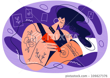 Female artist draw tattoo on client arm Female artist draw tattoo on client arm 109827376